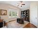 Bright home office with custom built-in shelves, desk, and hardwood floors at 4875 Churchill Ridge Dr, Cumming, GA 30028
