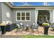Charming outdoor patio with stone flooring, seating and a tranquil setting, perfect for relaxation and entertaining at 4875 Churchill Ridge Dr, Cumming, GA 30028