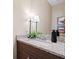 Stylish powder room features granite countertops and modern fixtures at 4875 Churchill Ridge Dr, Cumming, GA 30028
