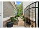Landscaped side yard with stone path and wrought iron gate at 4875 Churchill Ridge Dr, Cumming, GA 30028