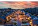 Sunset view of a charming neighborhood showcasing manicured lawns and tree-lined streets at 4875 Churchill Ridge Dr, Cumming, GA 30028