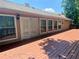 Large wooden back deck connected to the home with multiple windows, a door and exterior lighting at 5022 Anclote Dr, Alpharetta, GA 30022