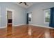 Large bedroom with vaulted ceiling, great light, and neutral walls at 5022 Anclote Dr, Alpharetta, GA 30022