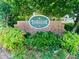 Timberlane community brick sign surrounded by lush greenery, highlighting its welcoming atmosphere at 5022 Anclote Dr, Alpharetta, GA 30022