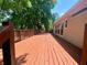 Large wooden deck with railings, great for outdoor entertaining at 5022 Anclote Dr, Alpharetta, GA 30022