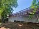 Back of house showing deck with brown railings and white lattice at 5022 Anclote Dr, Alpharetta, GA 30022