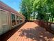 Spacious wooden deck perfect for entertaining with railings and room for seating at 5022 Anclote Dr, Alpharetta, GA 30022