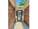 Covered entrance with glass detailed door and sidelights at 5022 Anclote Dr, Alpharetta, GA 30022