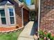 The front entrance is adorned with brick trim and an ornate glass door at 5022 Anclote Dr, Alpharetta, GA 30022