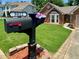Charming home featuring a manicured lawn and inviting mailbox with seasonal flowers at 5022 Anclote Dr, Alpharetta, GA 30022