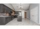 Modern kitchen with stainless steel appliances, grey cabinets, grey backsplash and a granite countertop island at 5022 Anclote Dr, Alpharetta, GA 30022