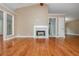 Bright and airy living room with fireplace and seamless transition to other areas at 5022 Anclote Dr, Alpharetta, GA 30022