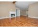 A cozy living room with fireplace and access to multiple rooms, great for entertaining at 5022 Anclote Dr, Alpharetta, GA 30022