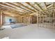 Unfinished basement with exposed beams, a concrete floor, and visible framework at 5545 Adirondack Dr, Cumming, GA 30040