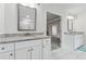Bathroom features a double sink vanity with white cabinetry and granite countertop at 5545 Adirondack Dr, Cumming, GA 30040