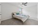 Neutral bedroom with a carpeted floor, a window, and a stylish bed with decorative pillows at 5545 Adirondack Dr, Cumming, GA 30040