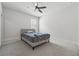 Neutral bedroom with a bed, ceiling fan and carpet at 5545 Adirondack Dr, Cumming, GA 30040