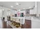 Spacious kitchen with a center island, pendant lighting, and open layout connecting to the dining area at 5545 Adirondack Dr, Cumming, GA 30040
