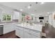 Well-lit kitchen with an island, ample counter space, and an open flow to the living area at 5545 Adirondack Dr, Cumming, GA 30040