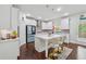 Modern kitchen with white cabinetry, stainless steel appliances, a large center island, and breakfast bar seating at 5545 Adirondack Dr, Cumming, GA 30040
