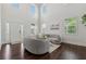 Bright and open living room with large windows, hardwood floors, and comfortable seating area at 5545 Adirondack Dr, Cumming, GA 30040
