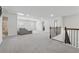 Spacious loft area with plush carpeting, comfortable seating, and open layout at 5545 Adirondack Dr, Cumming, GA 30040