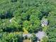Aerial view of a home with a pool on acreage at 686 Hillwood Ct, Dacula, GA 30019