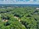 Acreage of homes surrounded by lush trees at 686 Hillwood Ct, Dacula, GA 30019
