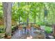 Serene back deck with lush greenery and comfortable seating, ideal for relaxing and enjoying nature at 686 Hillwood Ct, Dacula, GA 30019