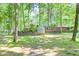Greenhouse and deck with mature trees offers tranquility and space for outdoor living at 686 Hillwood Ct, Dacula, GA 30019