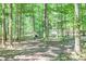 Expansive backyard with mature trees provides a serene setting for outdoor activities and relaxation at 686 Hillwood Ct, Dacula, GA 30019
