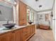 Bathroom with double sinks and a copper soaking tub at 686 Hillwood Ct, Dacula, GA 30019