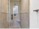 Tiled shower showcasing glass door and shower head at 686 Hillwood Ct, Dacula, GA 30019