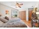 Comfortable bedroom boasts hardwood floors, ample closet space, and a relaxing atmosphere at 686 Hillwood Ct, Dacula, GA 30019