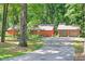 Exterior of the home featuring a driveway leading up to the house and garage at 686 Hillwood Ct, Dacula, GA 30019