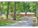 Exterior of the home featuring a driveway leading up to the house and garage at 686 Hillwood Ct, Dacula, GA 30019