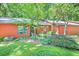 Charming home exterior with lush landscaping, mature trees, and inviting curb appeal at 686 Hillwood Ct, Dacula, GA 30019