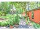 Exterior view of a home surrounded by lush landscape and mature trees at 686 Hillwood Ct, Dacula, GA 30019