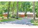 Ranch home with a two-car garage and ample parking in a wooded setting at 686 Hillwood Ct, Dacula, GA 30019