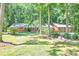 Charming single-story home surrounded by mature trees and landscaping at 686 Hillwood Ct, Dacula, GA 30019