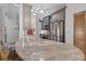 Modern kitchen island with a unique granite countertop, stainless steel appliances and plenty of storage space at 686 Hillwood Ct, Dacula, GA 30019