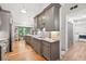 Contemporary kitchen with stainless steel appliances, granite counters, and sleek cabinetry, creating a stylish cooking space at 686 Hillwood Ct, Dacula, GA 30019