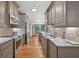 Spacious kitchen with stainless steel appliances, granite countertops, and stylish cabinetry at 686 Hillwood Ct, Dacula, GA 30019