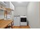 Functional laundry room with modern washer and dryer units, offering convenience and efficiency for household chores at 686 Hillwood Ct, Dacula, GA 30019