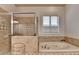 Bathroom with tub and walk in shower at 1668 Legrand Cir, Lawrenceville, GA 30043
