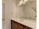 Bathroom featuring a mirror, a countertop, and wooden cabinets at 1668 Legrand Cir, Lawrenceville, GA 30043