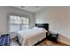 Bedroom with wood floor, ceiling fan and natural light at 1668 Legrand Cir, Lawrenceville, GA 30043