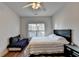 Bedroom with wood floor, ceiling fan and natural light at 1668 Legrand Cir, Lawrenceville, GA 30043