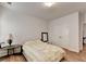 Bedroom featuring wood-look flooring, a large bed, and a closet at 1668 Legrand Cir, Lawrenceville, GA 30043