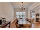 Well-lit dining area with hardwood floors and a large window that allows for natural light at 1668 Legrand Cir, Lawrenceville, GA 30043